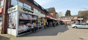 a store on a city street with a bakery at OneRoomStay in Delmenhorst