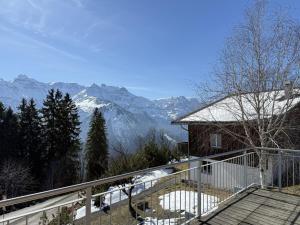 a balcony of a house with a view of mountains at Revier Schwettiberg Nr. 1 in Braunwald