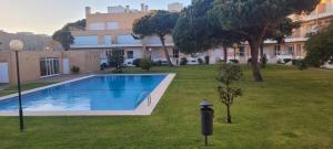 a swimming pool in a yard next to a building at Descanso, Mar & Conforto in Esposende +5 photos