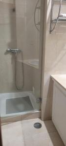 a bathroom with a shower and a bath tub at Descanso, Mar & Conforto in Esposende