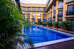 a large swimming pool in front of a building at Bessa Beach Hotel in João Pessoa +145 photos