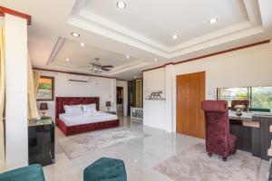 a large bedroom with a bed and a desk at Villa Natali between Rawai and Nai Harn in Rawai Beach +41 photos