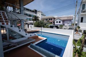 a view of a swimming pool from the balcony of a house at Villa Natali between Rawai and Nai Harn in Rawai Beach