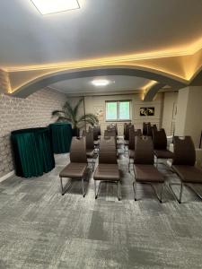 a large waiting room with chairs in a room at Sawei Urban Hotel in Craiova