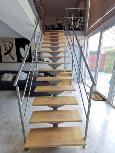 a staircase in a house with wooden steps at Seraphina in Zaventem