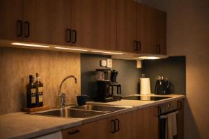 a kitchen with a sink and a counter top at The Studio in Skellefteå