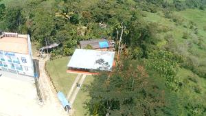 an overhead view of a building in a forest at Hotel Puerto azul in Chitaraque