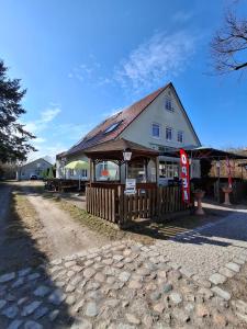 a building with a sign in front of it at Wandlitz-Pension Dampflok in Wandlitz
