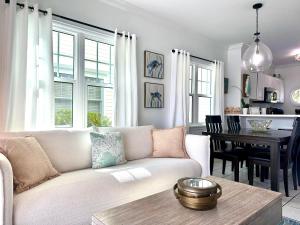 a living room with a white couch and a table at Seas the Keys Getaway in Duck Key