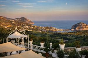 a gazebo with a view of the ocean at Hotiday Villa Neptunus in Forio d'Ischia