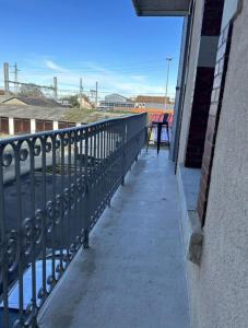 a balcony of a building with a fence at Hôtel de la gare - Petit Studio in Tarbes
