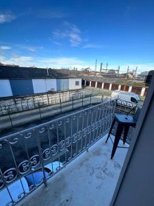 a balcony with a table on top of a building at Hôtel de la gare - Petit Studio in Tarbes
