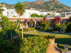 a view of a house with flowers and plants at Kefi Beach & Suites in Ortakent