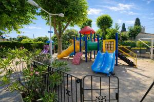 a playground in a park with a slide at Eden Cottages - Premium Cottage avec Piscine in Antibes