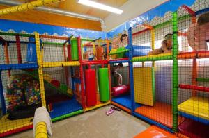 a play room with many different colored play equipment at Lakókocsi termál fürdő kemping in Túrkeve