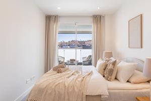 a bedroom with a bed and a large window at Casa Cala Serena in Mijas +15 photos