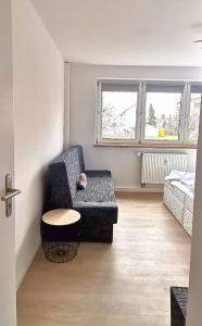 a living room with a couch and a table at DEBSI vacation rental in Bad Windsheim
