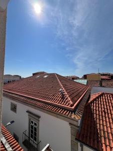 a view of a building with red tile roofs at Private Room in Old Town in Viana do Castelo +7 photos