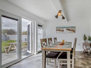 a dining room with a table and chairs at 3 Bed in Burnham-on-sea oc-92964 in Brean