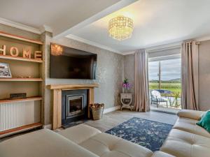 a living room with a couch and a fireplace at 3 Bed in Burnham-on-sea oc-92964 in Brean