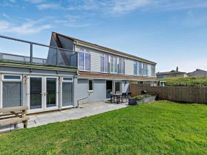a house with a patio and a fence at 3 Bed in Burnham-on-sea oc-92964 in Brean