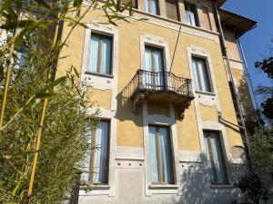 a building with a balcony on the side of it at Villa Guelpa in Lessona +18 photos