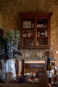a kitchen counter with a sink and a cabinet at Casa in Campagna Casagori in Pienza