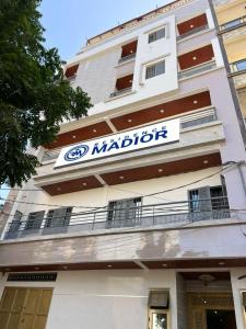 a building with a sign on the side of it at Résidence Madior C2 in Dakar