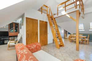a living room with a loft bed and a dining room at Plac Neptuna Bright Studio with Balcony by Noclegi Renters in Międzyzdroje