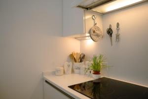 a kitchen with a sink and a counter top at The White coast studio in Nieuwpoort