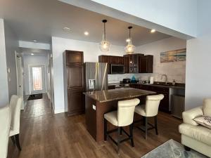 a kitchen with a large island in the middle at Cocagne Ocean Suites- Bed & Breakfast in Cocagne 
