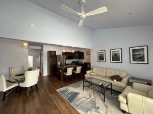 a living room with a couch and a table at Cocagne Ocean Suites- Bed & Breakfast in Cocagne 