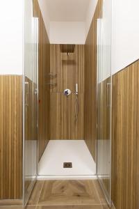 a shower with a glass enclosure in a bathroom at Costa d'Abruzzo - Casa Vacanza in Montesilvano +167 photos
