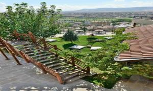 a wooden bench sitting on top of a roof at The Loop Cappadocia in Avanos