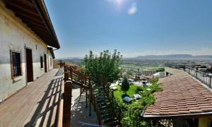 a balcony of a building with a garden on it at The Loop Cappadocia in Avanos