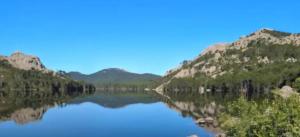 a view of a river with mountains in the background at Chambre Belvédère in Porto-Vecchio