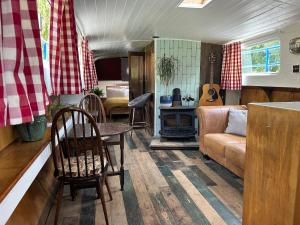 a living room with a couch and a table at Barge in central Cambridge in Cambridge
