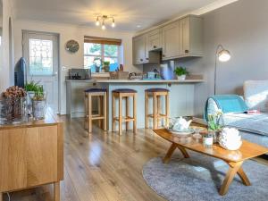 a kitchen and living room with a couch and a table at 2 Bed in York oc-81052 in Helmsley