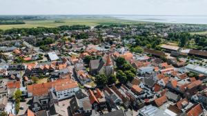 an aerial view of a town with buildings at Guesthouse Ouddorp Connection in Ouddorp