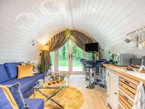 a living room with a blue couch and a table at 1 Bed in Consett oc-87933 in Shotley Bridge