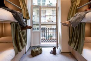 a room with two beds and a window at The Central House Valencia Mercado Central in Valencia