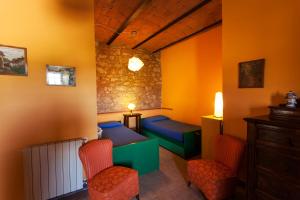 Televízia a/alebo spoločenská miestnosť v ubytovaní Agriturismo La Valentina Nuova