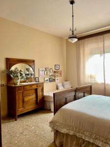 a bedroom with a bed and a sink and a mirror at Villa Ada in Monsummano Terme