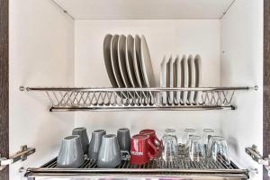 a kitchen with a bunch of utensils on a shelf at Doble Playa in Playa Paraiso
