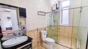 a bathroom with a toilet and a sink and a shower at Hà Chi Villla Hà Giang in Ha Giang +10 photos