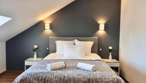 a bedroom with a bed with two pillows on it at Domaine de Treuillaud in Villers-les-Ormes