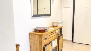 a mirror on top of a wooden dresser in a room at Imperial Golden Suite by Ca-Sa Check in Chioggia