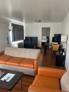 a living room with a couch and a table at Motel 6-Prescott, AZ in Prescott