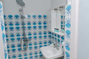 a bathroom with a shower and a sink at San Georgio Hotel in Tsoutsouros +89 photos