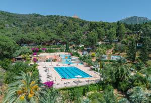 an aerial view of a resort with a swimming pool at Glamping Elba in SantʼAnna